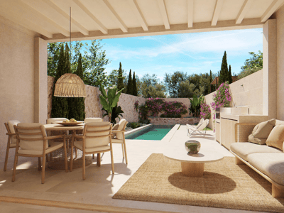 Terrasse couverte avec salle à manger, canapé et cuisine extérieure donnant sur une piscine et un jardin luxuriant.