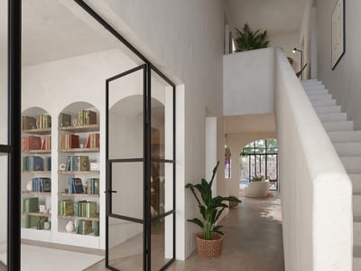 Bright hallway featuring arched built-in bookshelves, black-framed glass doors, and a minimalist white staircase.