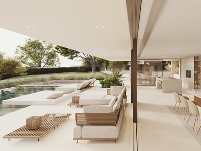 Modern luxury terrace with white lounge furniture and a pool next to an open-plan indoor dining area.