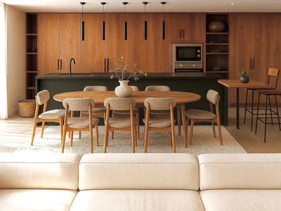 Cocina moderna con gabinetes de madera, isla negra y mesa de comedor ovalada con seis sillas sobre alfombra clara.