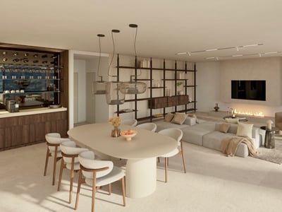 Salón moderno de planta abierta con gran mesa de comedor, sofá modular, chimenea minimalista y luces de diseño.