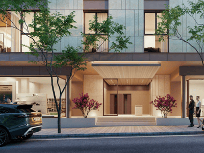 Planta baja de un edificio moderno con entrada central, escaparates de cristal, árboles y coches de lujo.