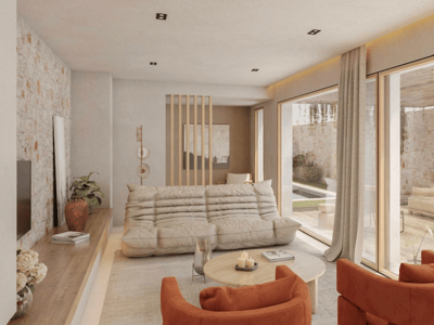 Modern living room featuring a beige sofa, burnt orange armchairs, and floor-to-ceiling glass doors opening to a stone terrace.