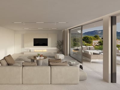 Salón espacioso en tonos neutros con gran sofá, chimenea integrada y puertas de cristal hacia la terraza.