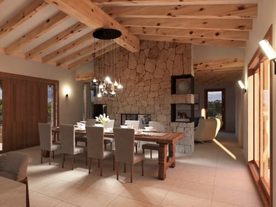 Interior view of a luxury dining room with high wooden beam ceilings, a natural stone feature wall, and a large dining table.