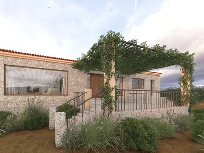 Modern stone villa facade featuring a vine-covered pergola, large windows, and natural Mediterranean landscaping.