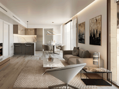 Salón moderno con sofá beige, mesa de mármol, suelos de madera y cocina integrada al fondo.