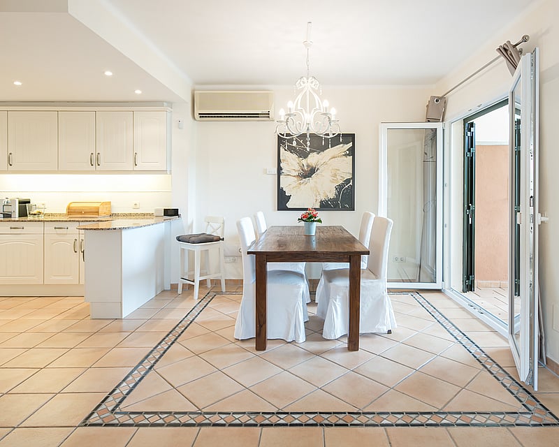 Expansive terrace with infinity pool. Panoramic sea views. Modern design with elegant outdoor furniture and lush vegetation.