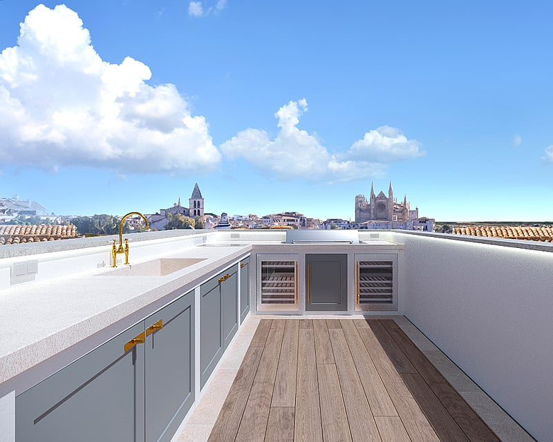 Rooftop kitchen with grey cabinets, gold faucet, and a view of a cathedral under a blue sky.