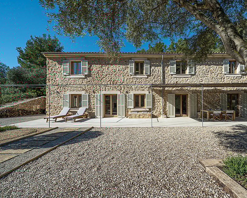 Spacious terrace with pool and seating area. Modern, minimalist architecture. Garden views. Ideal for relaxation and entertainment.