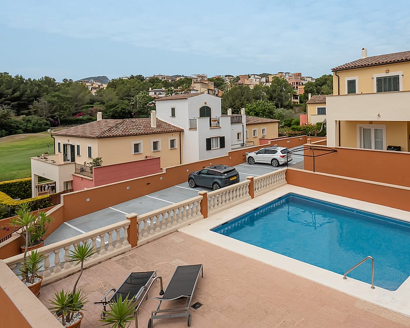 Exterior view of modern house with pool, lush garden, and high-quality finishes. Minimalist architecture.