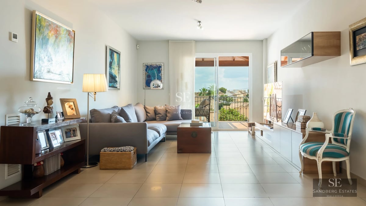 Image of an elegant swimming pool with sun loungers and lush vegetation. Modern architecture and relaxing atmosphere.