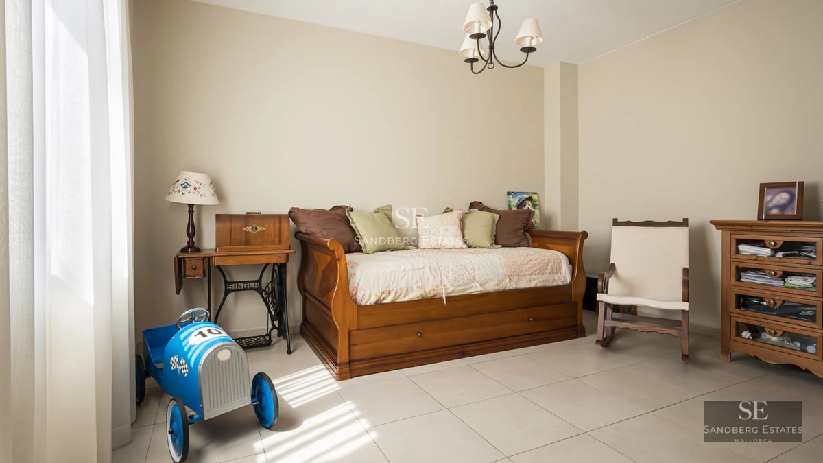 View of an elegant villa with infinity pool, lush garden, and spacious terraces. Modern architecture with large windows.