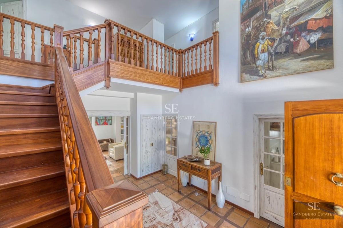 Expansive terrace with infinity pool, panoramic views, and modern furniture. Minimalist design with abundant natural light.