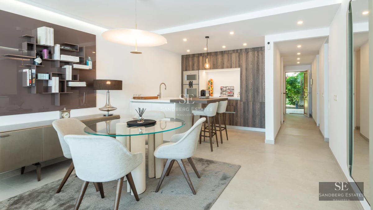 Exterior view of modern villa with infinity pool, expansive terraces, and minimalist architectural design in natural surroundings.