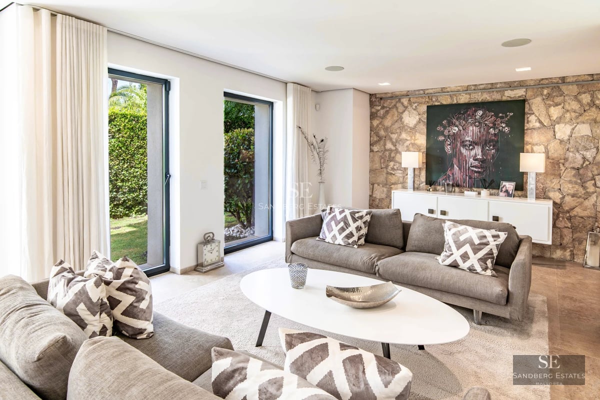 Spacious terrace with infinity pool, sun loungers, and panoramic views. Modern design with clean lines and high-quality materials.