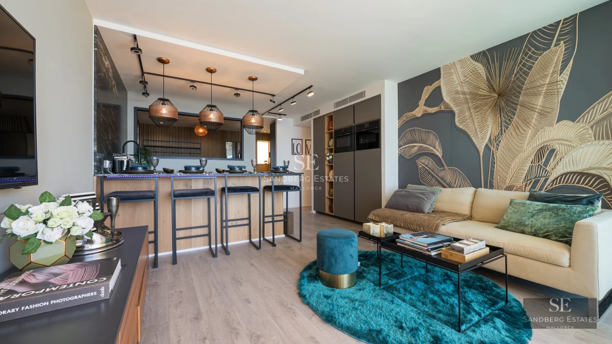 View of a luxurious pool with a sundeck and armchairs. Lush garden with tropical vegetation. Modern design with ambient lighting.