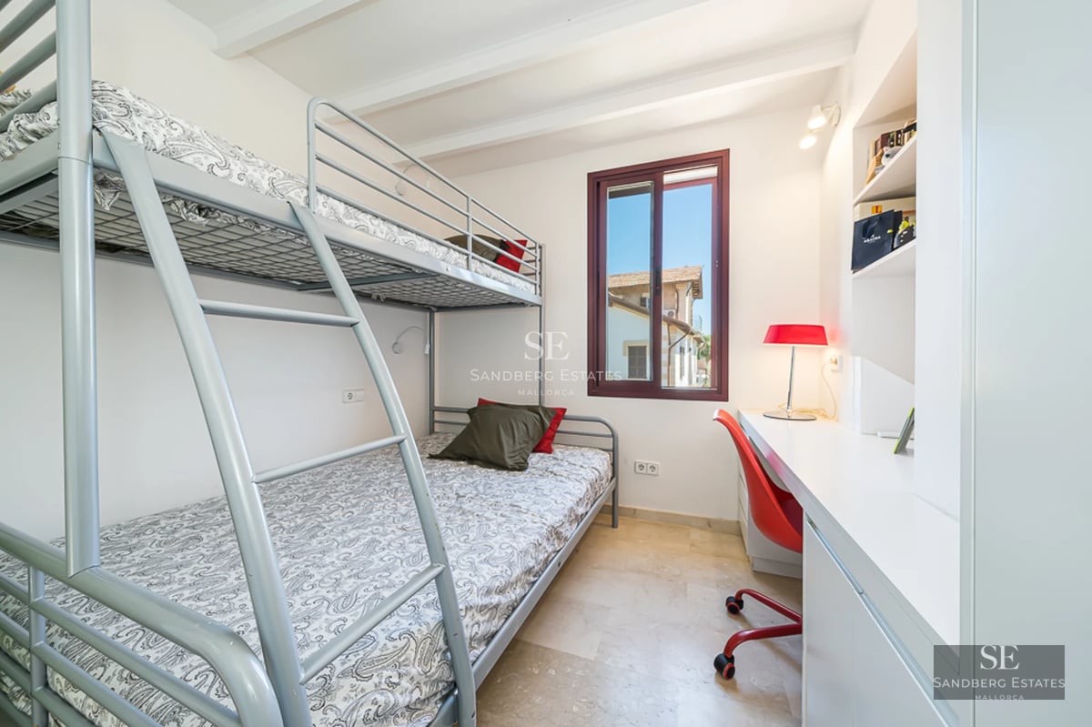 Spacious terrace with infinity pool, sun loungers and panoramic views. Modern design with wooden flooring and glass railing.