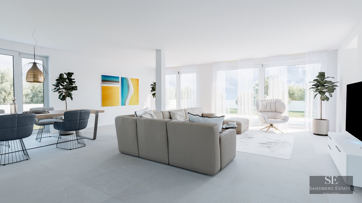 Bright minimalist living room with beige sofa, blue dining chairs, and large windows overlooking a garden.