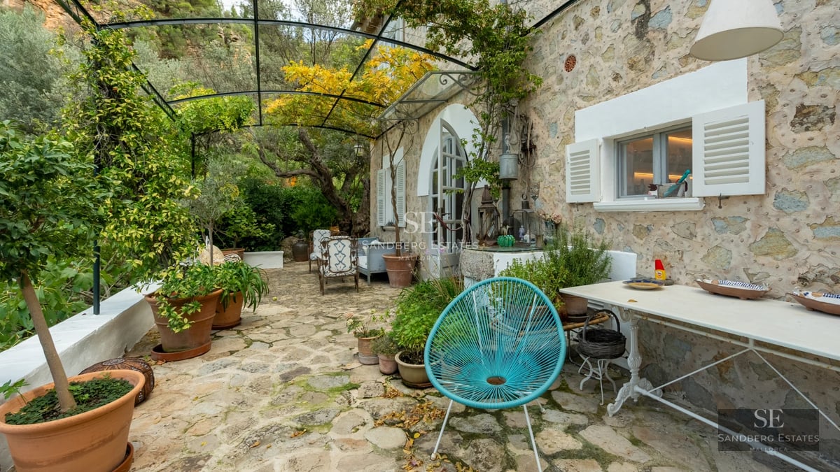 Exterior view of a modern villa with a pool, manicured lawn, and large windows. Minimalist architecture and contemporary design.