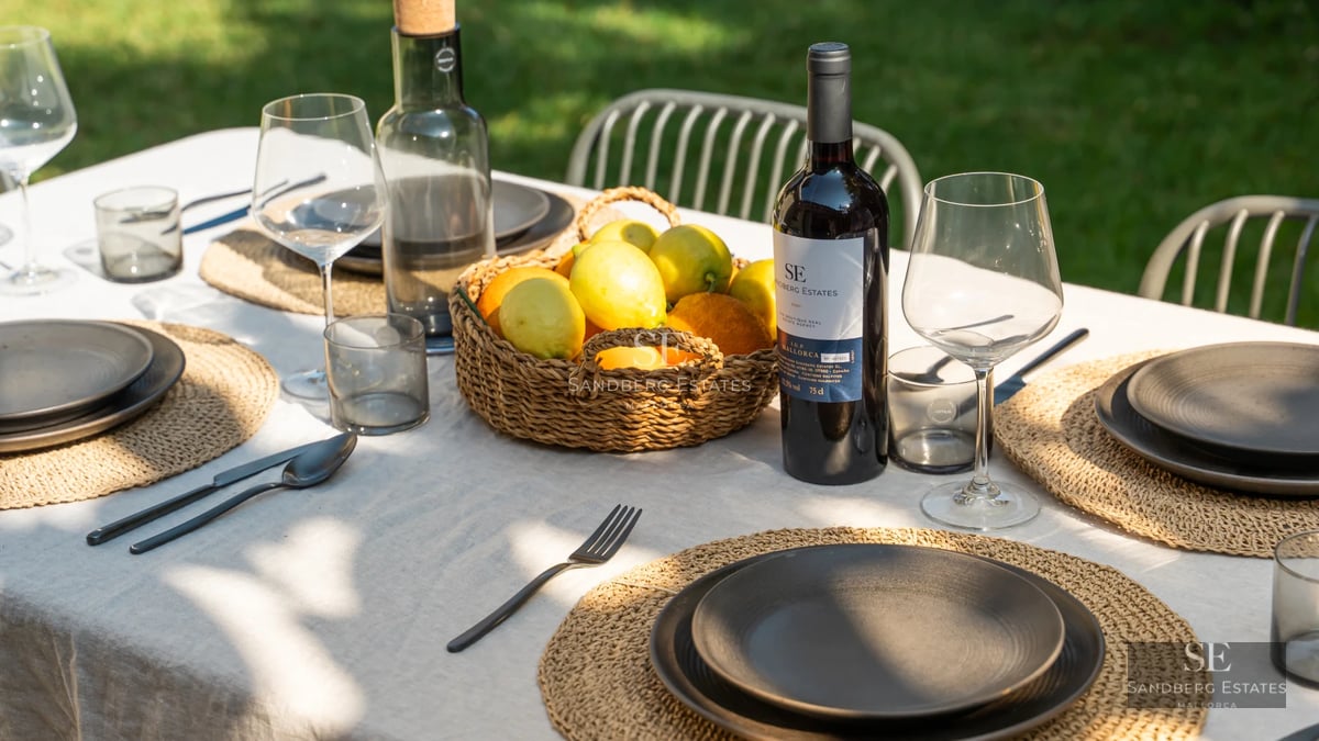 Expansive terrace with pool and panoramic views. Modern design, elegant sun loungers, and lush greenery.