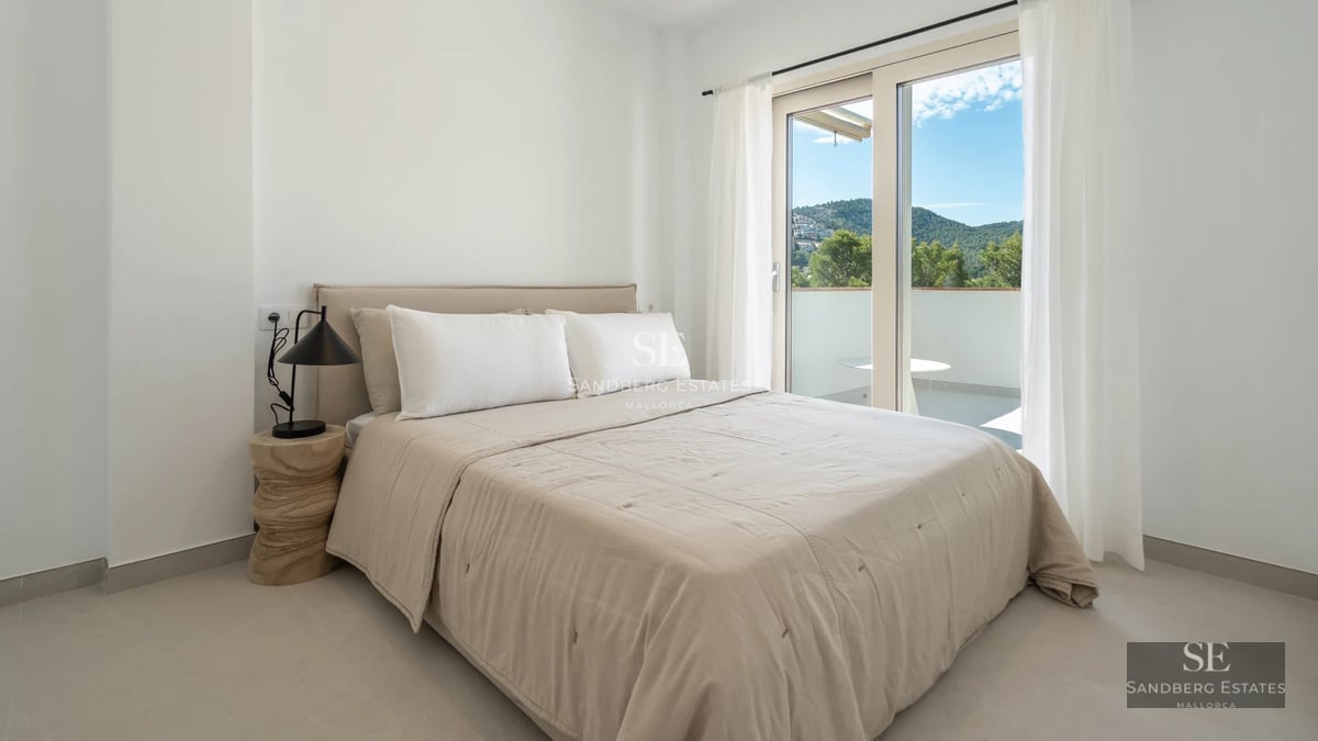 Expansive pool surrounded by lush vegetation and a modern villa with large windows. Minimalist and elegant design.