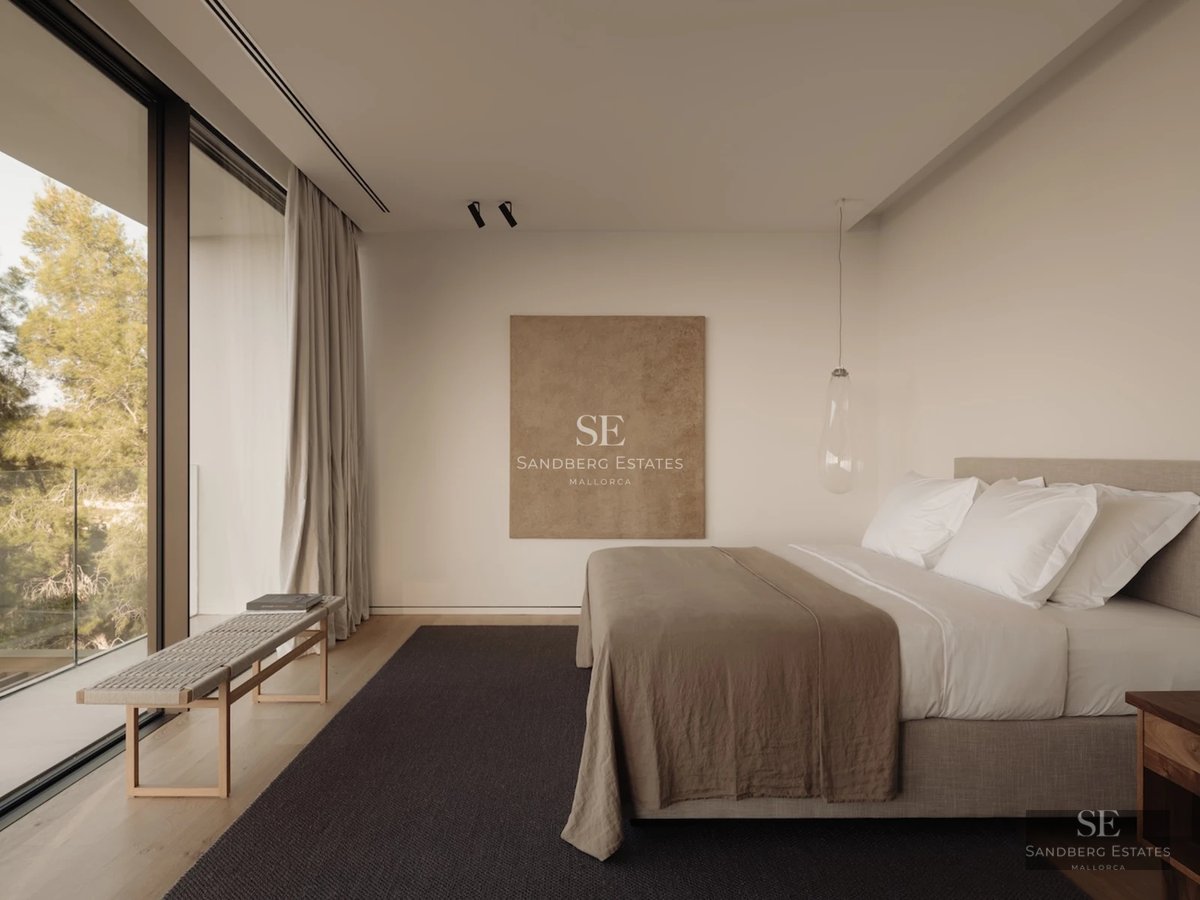 Exterior view of a modern villa with infinity pool. Minimalist architecture, large windows, and lush garden.