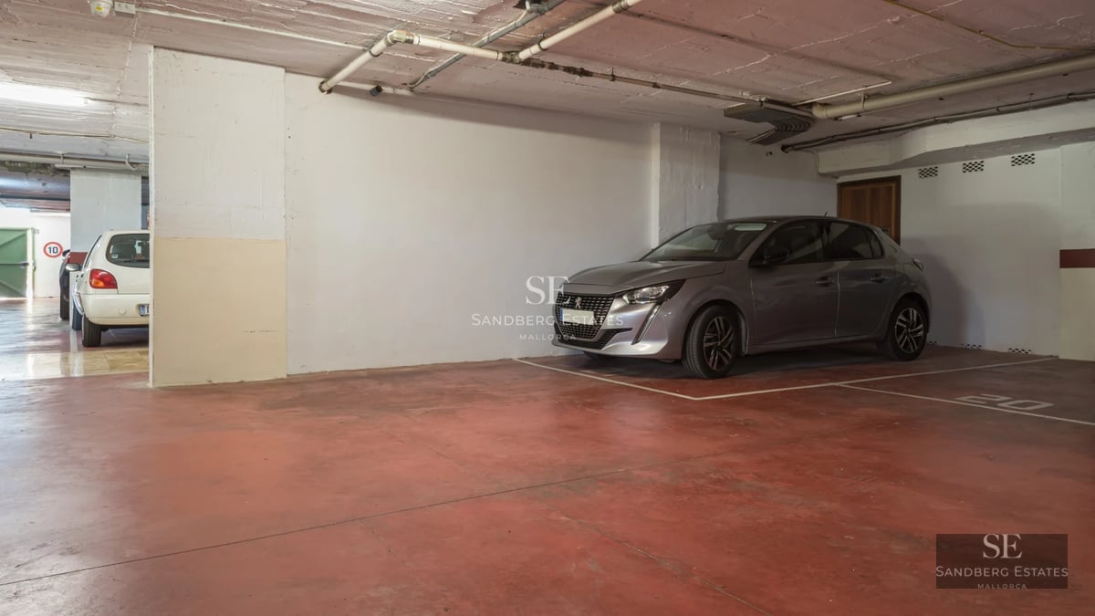 Exterior view of a modern villa featuring an infinity pool, manicured garden, and spacious terraces. Minimalist architectural design.