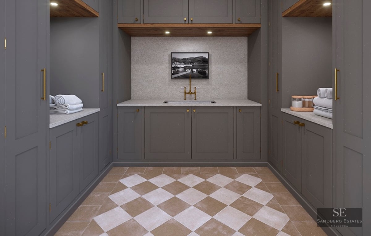 Utility room featuring dark gray cabinets, brass fixtures, and a checkerboard tile floor.