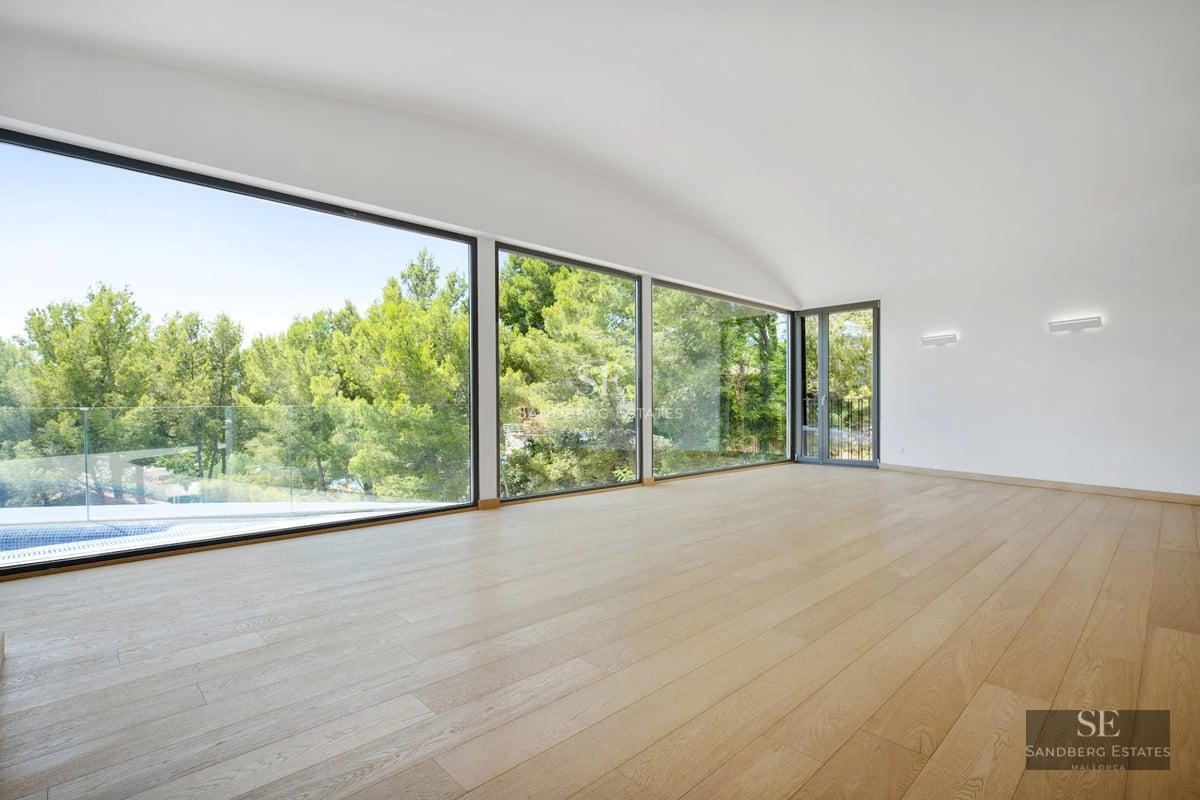 Exterior view of a modern villa with pool, terraces, and lush garden. Sleek design and expansive green spaces.