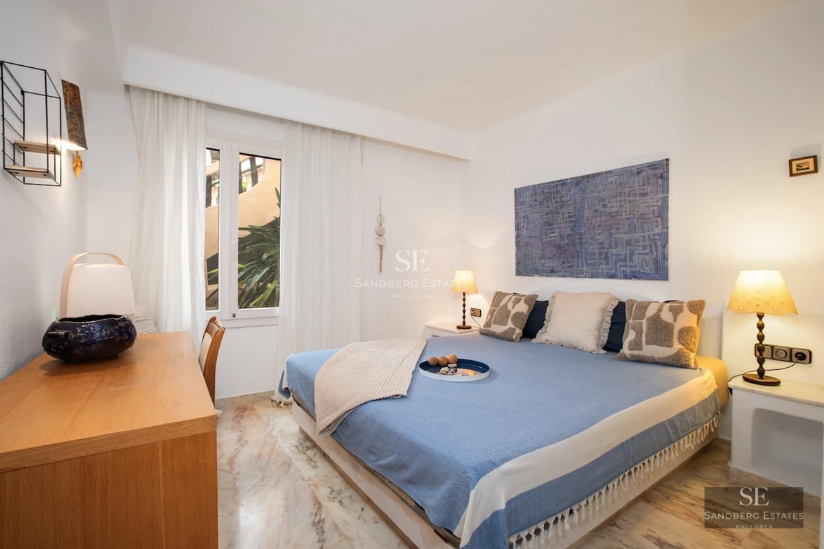 Spacious living room with panoramic windows, fireplace, and modern décor. Breathtaking sea views. Abundant natural lighting.