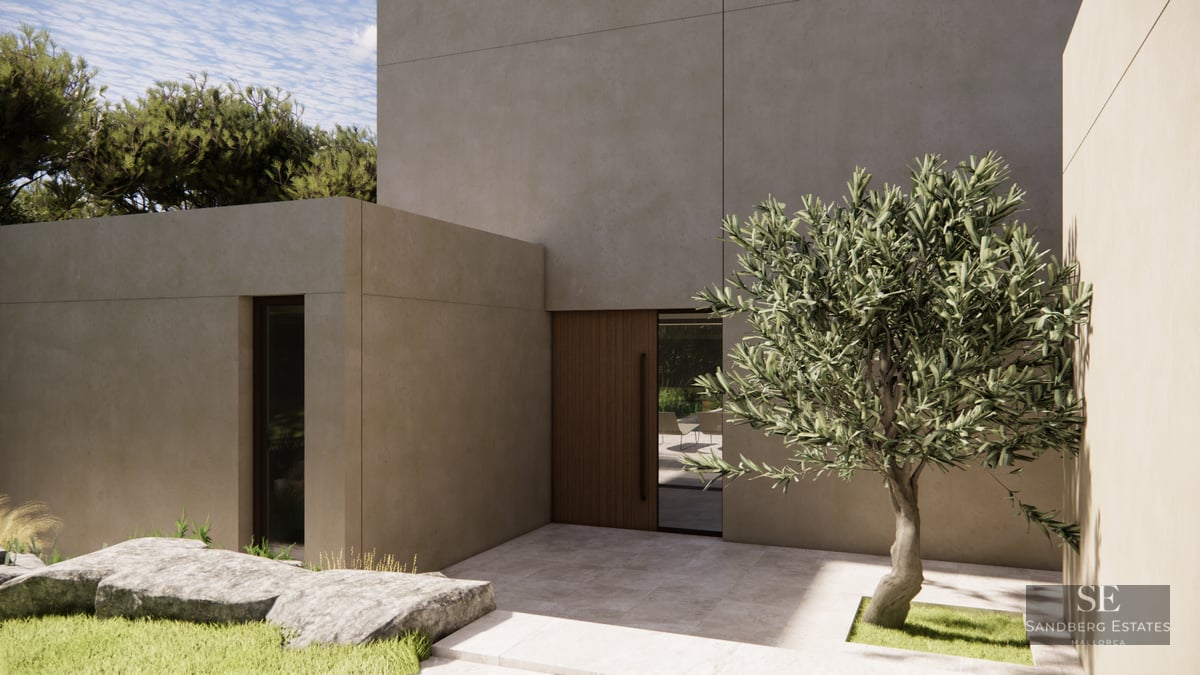 Modern villa entrance featuring beige concrete walls, a wooden door, and a single olive tree in a stone courtyard.