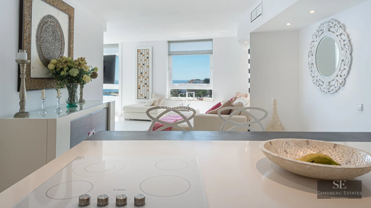 Contemporary design villa featuring an infinity pool, spacious terraces, lush vegetation, and panoramic sea views.