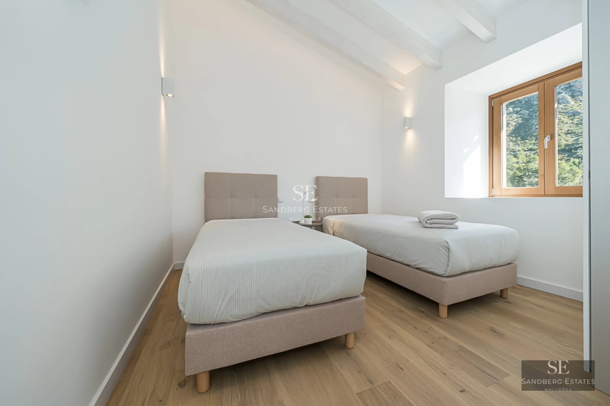 Exterior view of a modern villa with a pool, garden, and terraces. Sleek design with large windows and manicured landscaping.