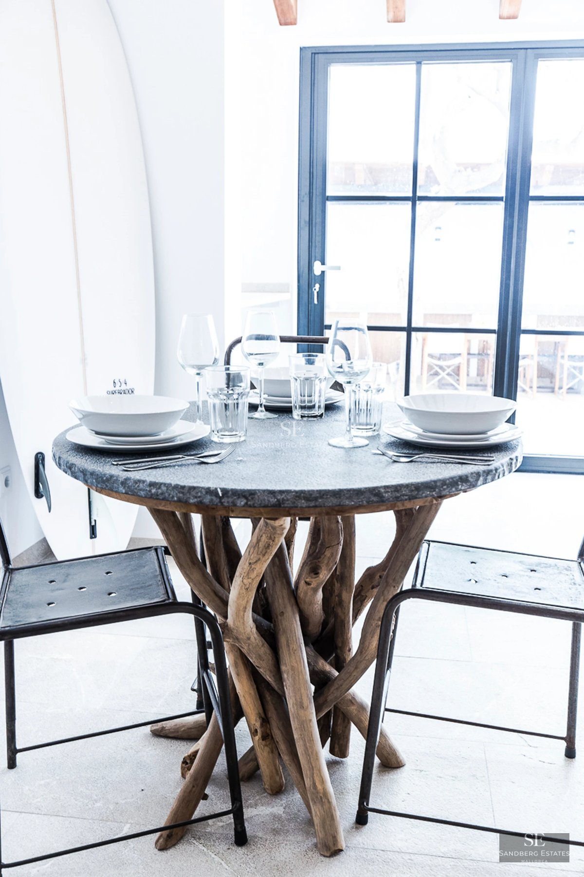 Spacious terrace with infinity pool, sun loungers, and panoramic views. Modern design featuring glass railing and lush greenery.