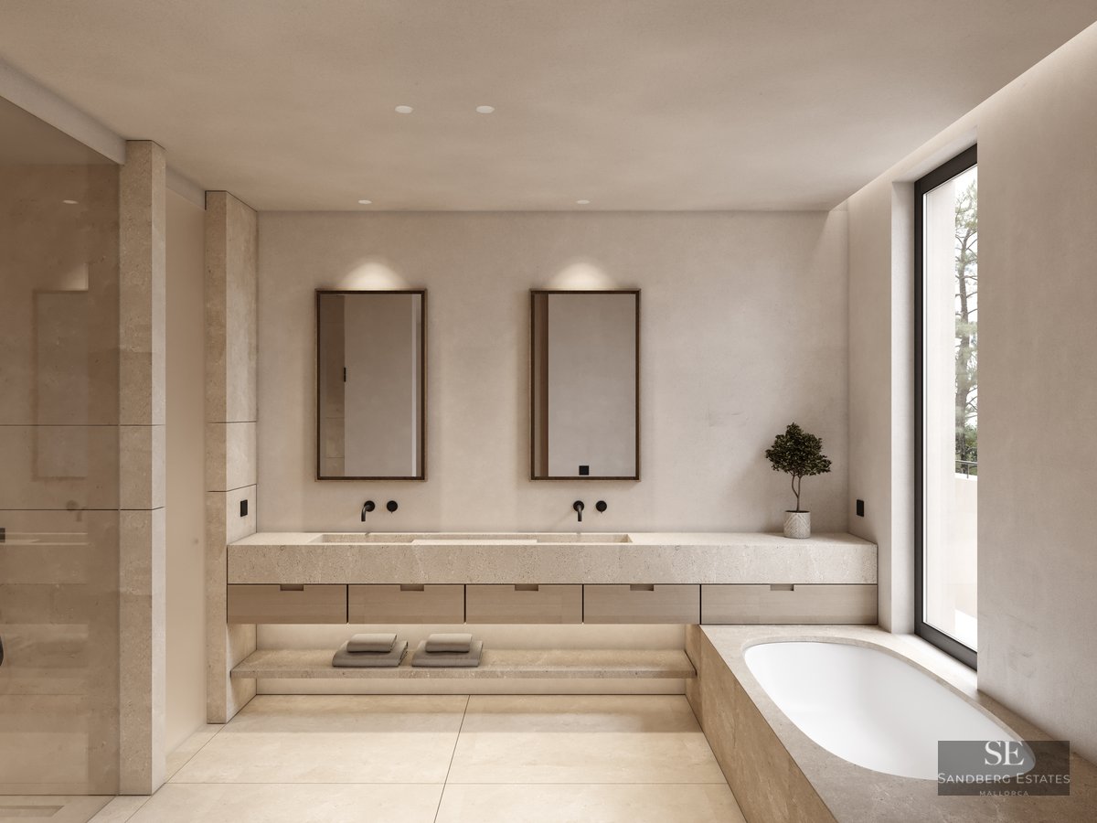 Luxury bathroom with double stone vanity, built-in tub, and large window with natural light.
