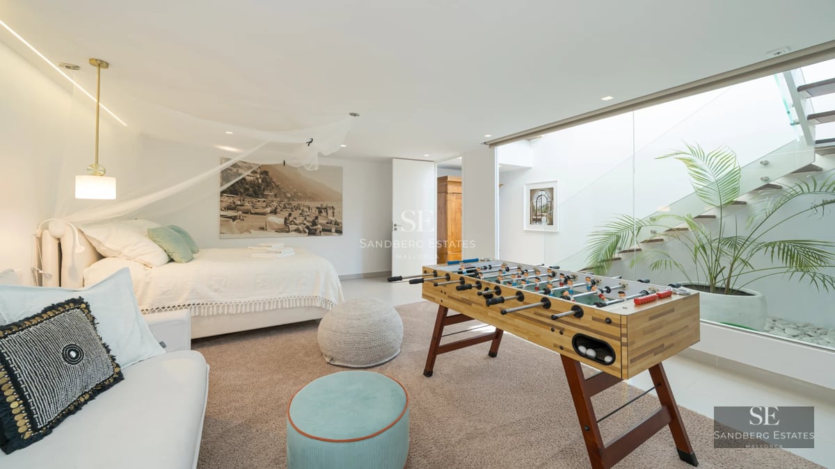 Modern exterior with infinity pool, sun loungers, minimalist architecture, green garden, and clear sky. Natural lighting.