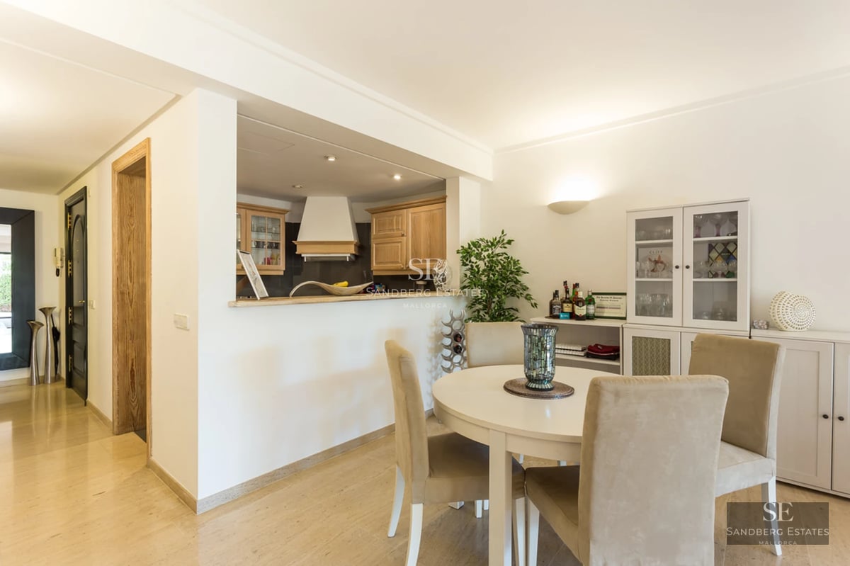 Exterior view of a modern villa with infinity pool, large garden, and minimalist architecture. Warm lighting and elegant design.
