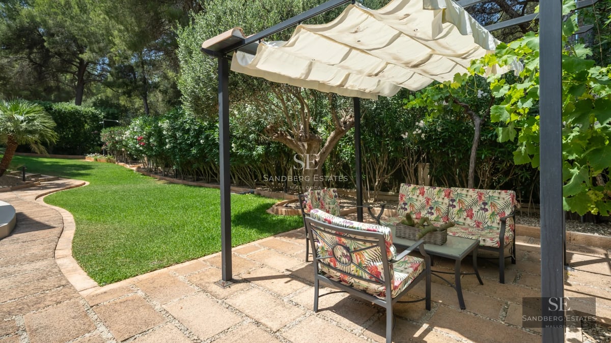 Exterior of a modern home with infinity pool, lush garden, and expansive terraces. Minimalist architecture.