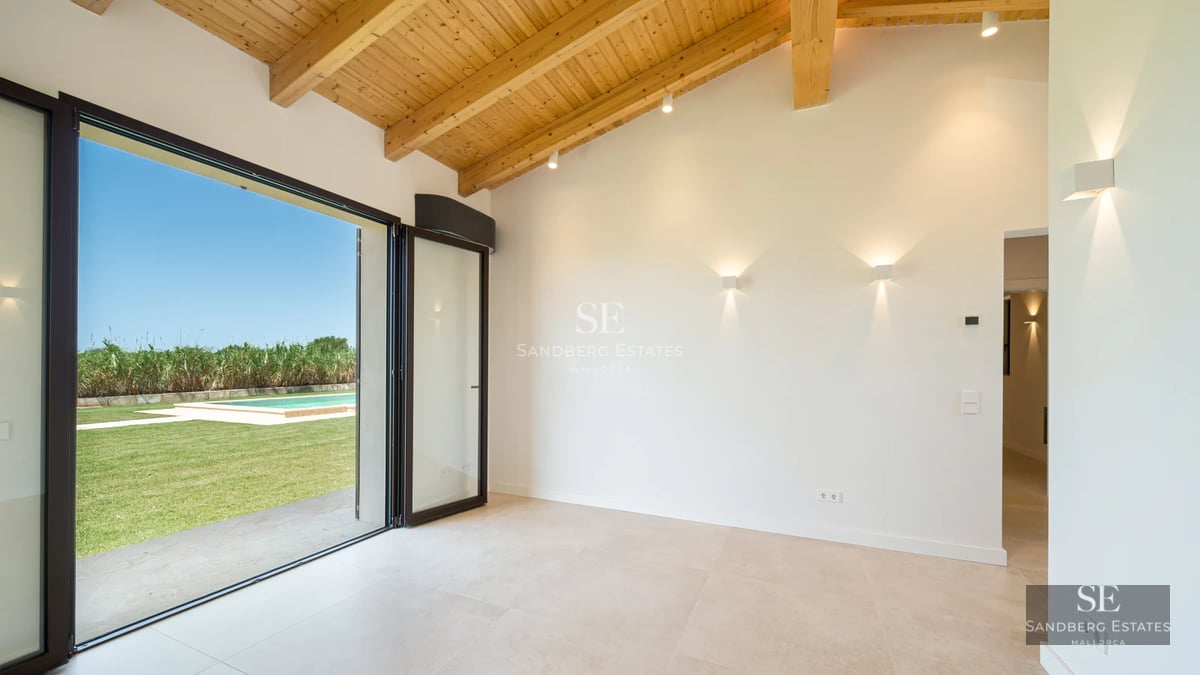 Expansive terrace with modern pool, sun loungers, and lush greenery views. Minimalist design with natural light.