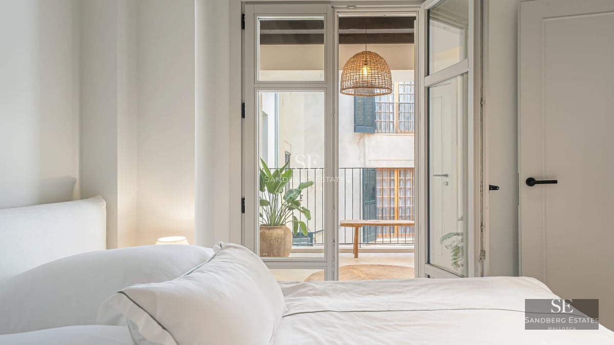 Modern villa exterior with reflecting pool, large windows, and minimalist landscaping. Warm lighting and contemporary architecture.