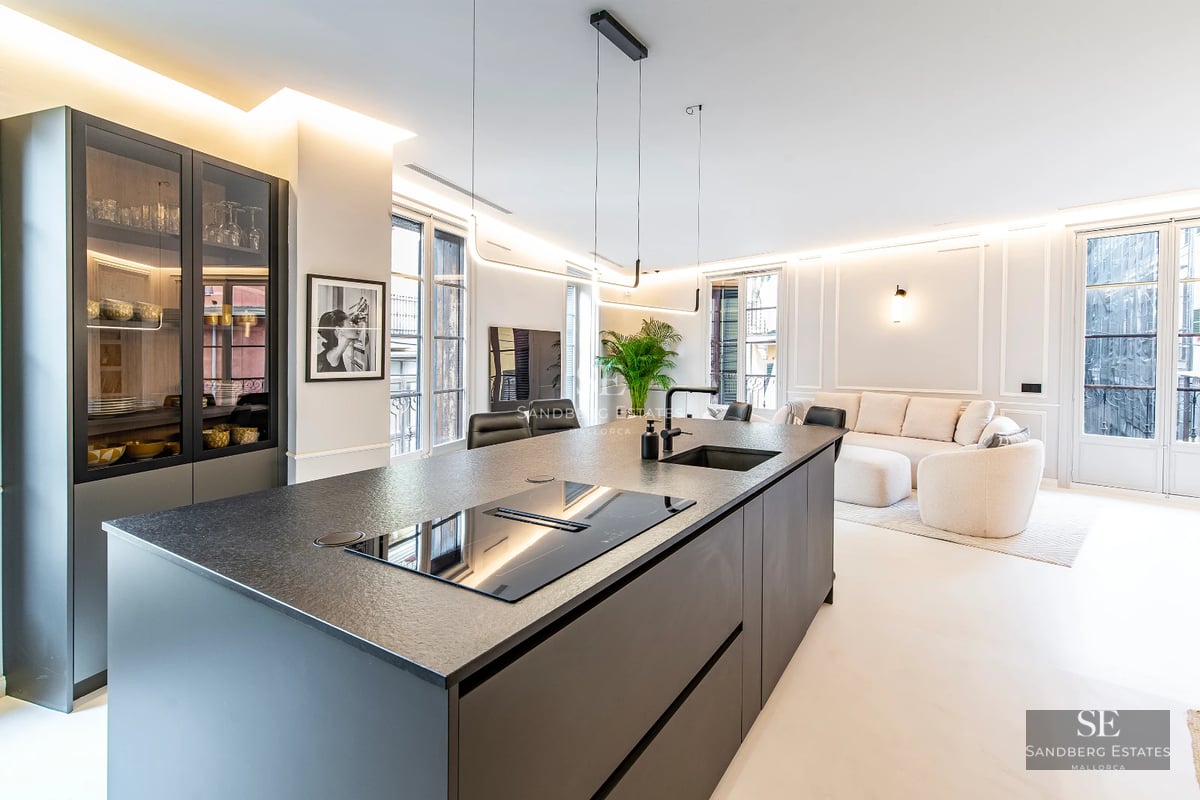 Exterior of a modern villa featuring an infinity pool, manicured garden, and minimalist architecture. Soft evening light.