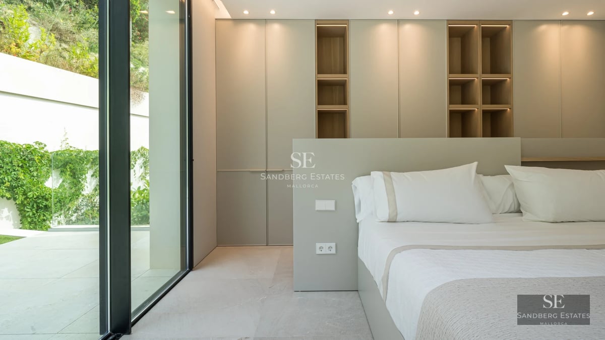 Exterior view of a modern villa with a pool, large garden, and elegant architecture. Minimalist design with large windows.