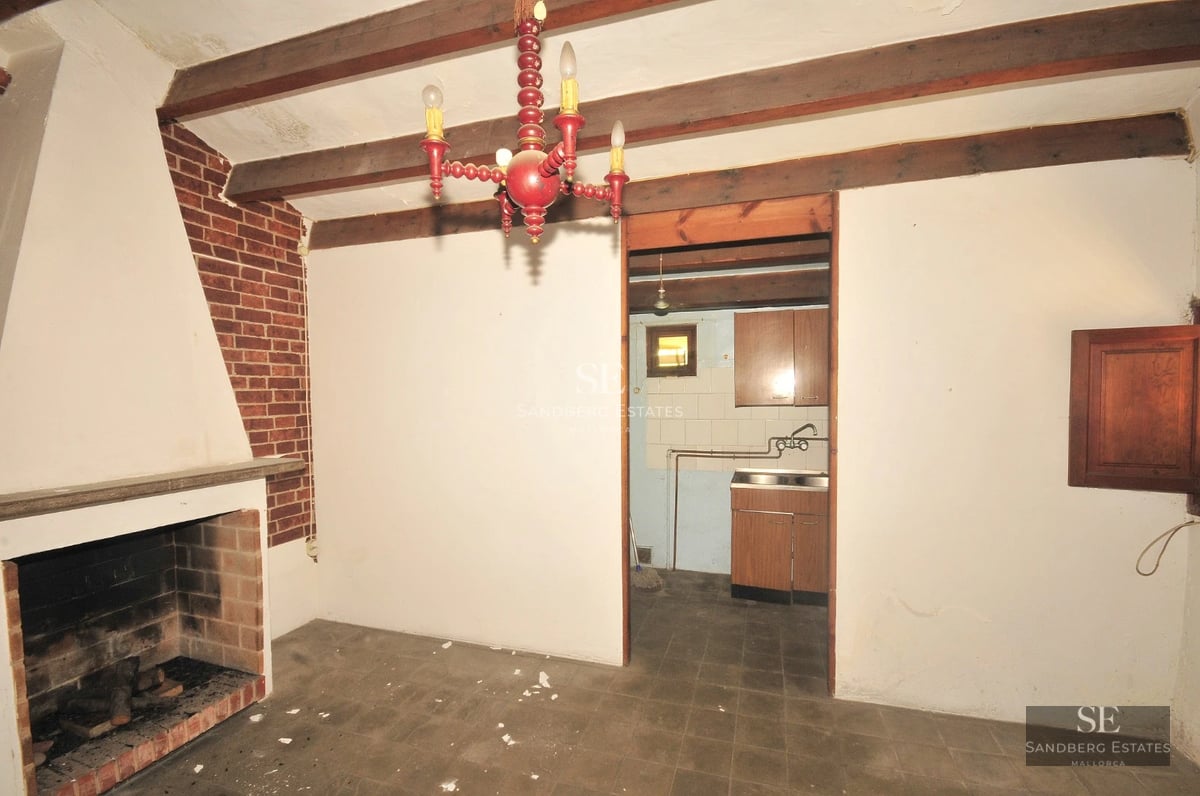 Spacious balcony with panoramic sea views. Glass railing, wooden floor, modern and elegant furniture.