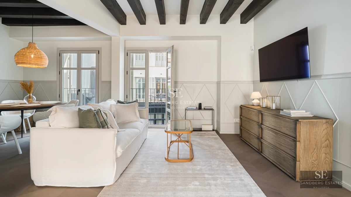 Exterior view of a modern villa with a pool, garden, and terrace. Minimalist design, high-quality finishes, and abundant natural light.