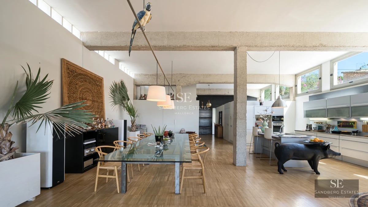 Exterior view of modern villa featuring infinity pool, large windows, and lush garden. Minimalist architecture and manicured landscaping.