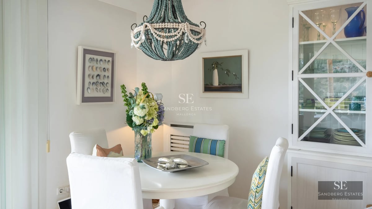 Exterior view of a modern villa with a swimming pool, lush landscaping, and expansive terraces. Minimalist architecture with large windows.