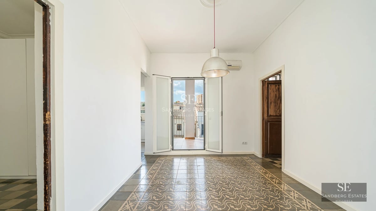 Image of a luxurious reflecting pool with a modern villa in the background, surrounded by lush vegetation.