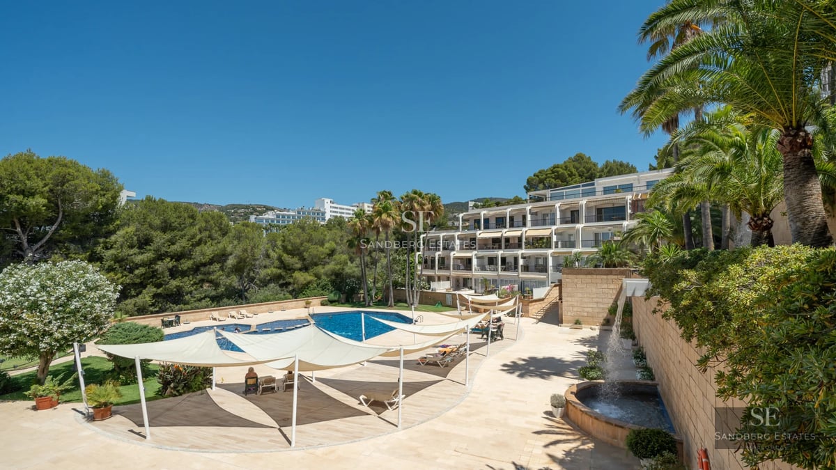 Exterior of a modern villa with infinity pool, spacious terraces, and panoramic views. Minimalist design with clean lines and high-end materials.