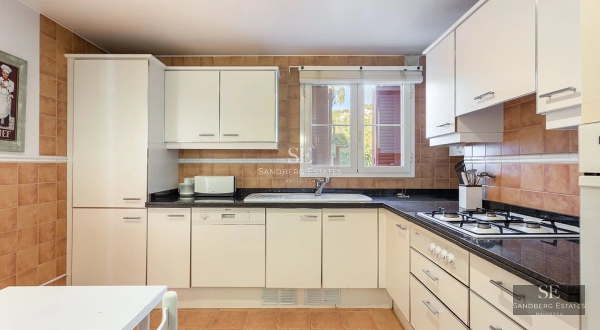 Expansive terrace with an infinity pool and ocean views. Modern design with stylish outdoor furniture and lush greenery.